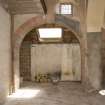 Interior. Coach house, view of archway with window above