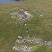 Oblique aerial view of the Saxa Vord radar station and the cairns, looking E.