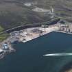 Oblique aerial view of the industrial area, looking NW.