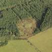 Oblique aerial view of the remains of Clune Wood Recumbent Stone Circle, taken from the SSW.