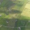 Oblique aerial view centred on the remains of the broch at Vinquin, taken from the NE.