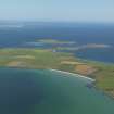 Oblique aerial view across the Bay of Holland, Stronsay with Papa Stronsay beyond, taken from the SW.