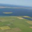 General oblique aerial view from the N end of Stronsay looking towards the Holm of Huip and Spurness Sound, taken from the SSE.