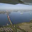 General oblique aerial view of the Forth Rail Bridge with the Queen Mary 2 in the back ground, taken from the S.