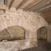 Interior. Kiln, view of arched openings at E end