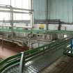 Bottling Plant. Interior. Bottling linebetween bulk glass de-palletiser and rinser