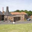 Belhaven Brewery. View from east of former kilns with maltings behind. The left hand kiln (late 19th century) has a later access door punched through the SE wall.