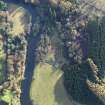 Oblique aerial view centred on the excavations of the round house and other archaeological features, taken from the N.