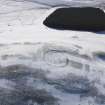 Oblique aerial view of settlement and cord rig under snow, looking to WSW.