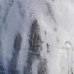 Oblique aerial view of palisaded enclosure and settlement under snow, looking to S.