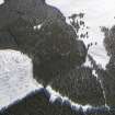 Oblique aerial view of scooped settlement and settlement under snow, looking to NE.