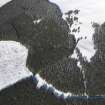 Oblique aerial view of scooped settlement and settlement under snow, looking to NE.