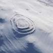 Oblique aerial view of Ring Chesters fort under snow, looking to the SSE.