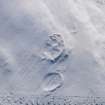 Oblique aerial view of settlements under snow, looking SSE.