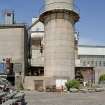 General view of base of chimney and admin/workshops from SE.