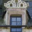 NE side. Dormer window with carved pediment over. Detail