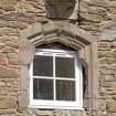 S range of steading, detail of window with re-used corbel above in S gable