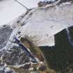 Oblique aerial view of fort under snow, looking NW.