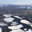 General oblique aerial view of the Tweed with Lilliesleaf in the middle distance and the snow covered Cheviots beyond, looking ESE.