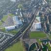 Oblique aerial view of Lanark centred on the retail park and sports centre, taken from the E.