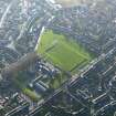 Oblique aerial view of Lanark centred on Lanark Primary School, taken from the NE.