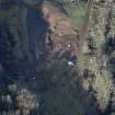 Oblique aerial view of the excavation of the site, taken from the SSE.