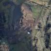 Oblique aerial view of the excavation of the site, taken from the SE.