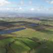 General oblique aerial view looking across the peat works at Gardrum Moss towards Grangemouth, taken from the SW.