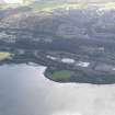 General oblique aerial view looking across the remains of the timber ponds towards Port Glasgow, taken from the N.
