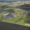 General oblique aerial view looking across the ash disposal site at Preston Island towards Valleyfield, with the remains of the colliery adjacent, taken from the SSE.