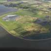 General oblique aerial view looking across the ash disposal site at Preston Island towards Culross and Valleyfield, with the remains of the colliery adjacent, taken from the SE.