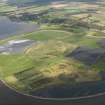 General oblique aerial view looking across the ash disposal site at Preston Island towards Culross and Valleyfield, with the remains of the colliery adjacent, taken from the SE.