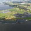 General oblique aerial view looking across the ash disposal site and remains of the colliery at Preston Island, towards Culross and Valleyfield, with the chimney of Longannet power station visible in the distance, taken from the E.