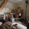 Interior. View of former milling floor, S range, first floor: the three sets of stones have been retained. The corner set were the Shelling Stones of Derbyshire grit; extreme rigt is the oat meal stones and the stone in the foreground is the runner stone of the bere meal stones.