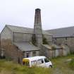 General view from NW. The lean to buildings housed the exausters (left) and the purifiers (right). By 1959, there wer two gasholders, one of which was disused