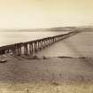 View of the Tay Bridge looking towards Dundee. 
Titled: 'New Tay Viaduct from S. 7406. J.V'.
