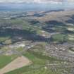 General oblique aerial view of the city taking in the countryside beyond, taken from the S.