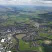 General oblique aerial view of the city and the countryside beyond, taken from the E.