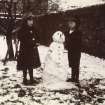 View of two children with a snowman in garden.
Page 18/8 PHOTOGRAPH ALBUM NO 34: 16 LEAMINGTON TERRACE, MATHER FAMILY ALBUM
