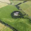 Oblique aerial view of the cropmarks of the pits and Stenrieshill farm, taken from the SW.