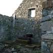 Interior view of Cornaigmore Mill, Tiree, looking towards the Northern gable wall.