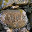 Detailed view of inscribed stone within the thatched cottage at Kilkenneth, Tiree.