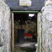 Detailed  view of the main entrance door to the front (East) elevation of the traditional cottage in Balemartine, Tiree.