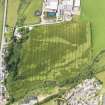 Oblique aerial view of the cropmarks of the palisaded enclosure and possible souterrain, taken from the ENE.