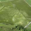 Oblique aerial view centred on the cropmarks of the barrow, taken from the S.