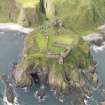 Aberdeenshire, Dunnottar Castle. Oblique aerial view looking to the W.