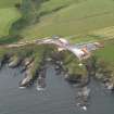 Oblique aerial view of the survival craft inspectorate yard and the site of St Ternan's Chapel and Well, looking to the WNW.