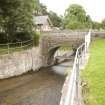 General view of bridge over the sluice leading from the leading the dam, from NW.