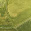 Oblique aerial view of the cropmarks of the barrows and pits, looking to the N.