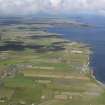 General oblique aerial view looking along the north coast across John O' Groats towards Gills Bay, taken from the E.